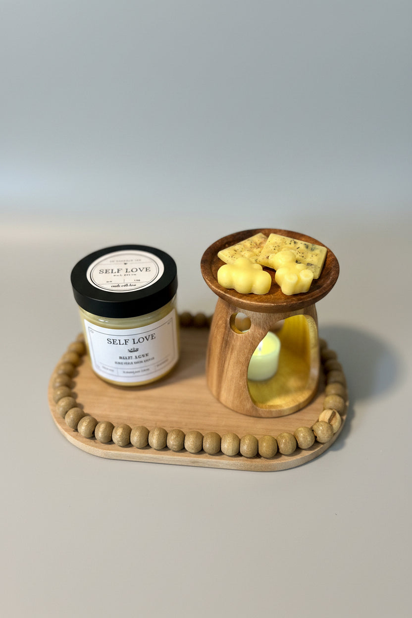 A wooden wick holder with two jars of wax tarts on top, one labeled 'Patchouli' and the other labeled 'Santalwood'. The wax tarts are in the process of melting.