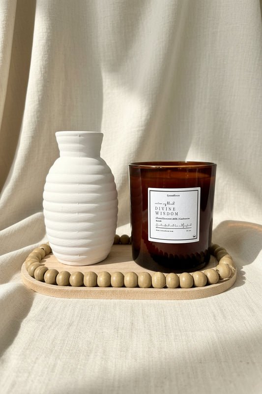 LJ Candle Co Divine Wisdom candle with intricate label design, featuring a calming, elegant appearance suitable for home decor.