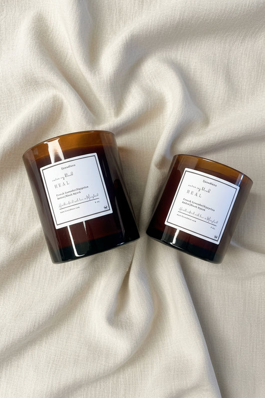 LJ Candle Co Heal scented candle in a glass jar with a natural wax finish and a sleek minimalist label.