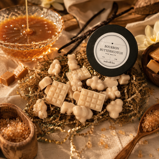 LJ Candle Co Bourbon Butterscotch wax melts in a clear plastic tray, showcasing warm amber-colored wax pieces.
